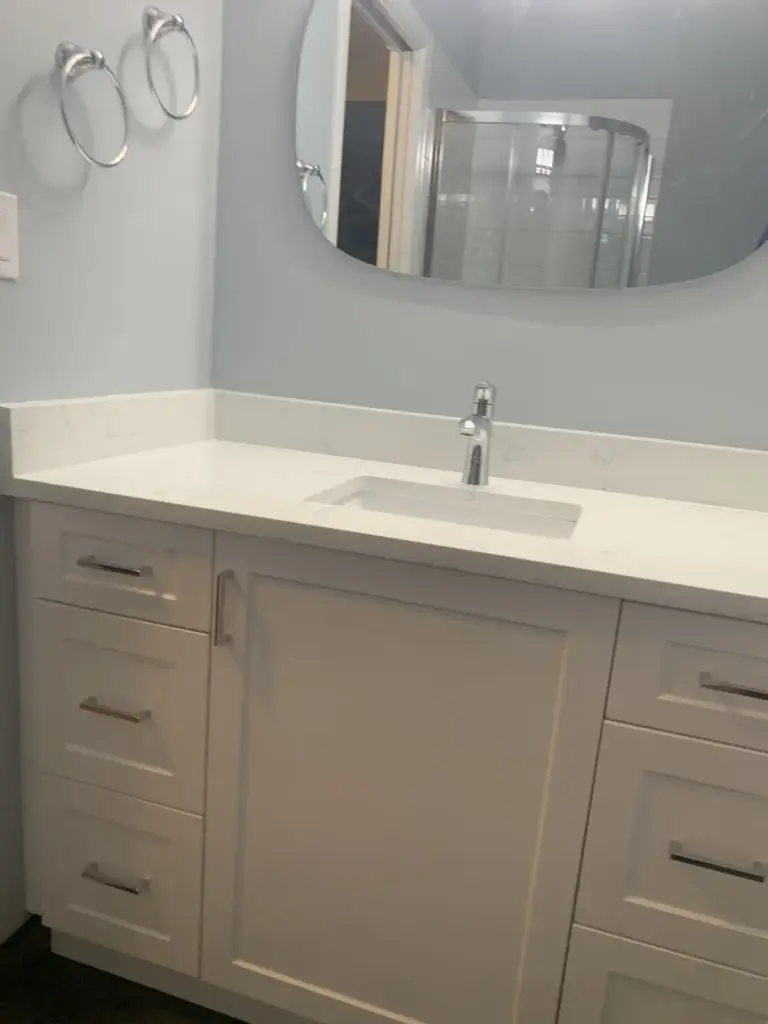 Shaker vanity with a stone countertop, lower bathroom renovation in Surrey