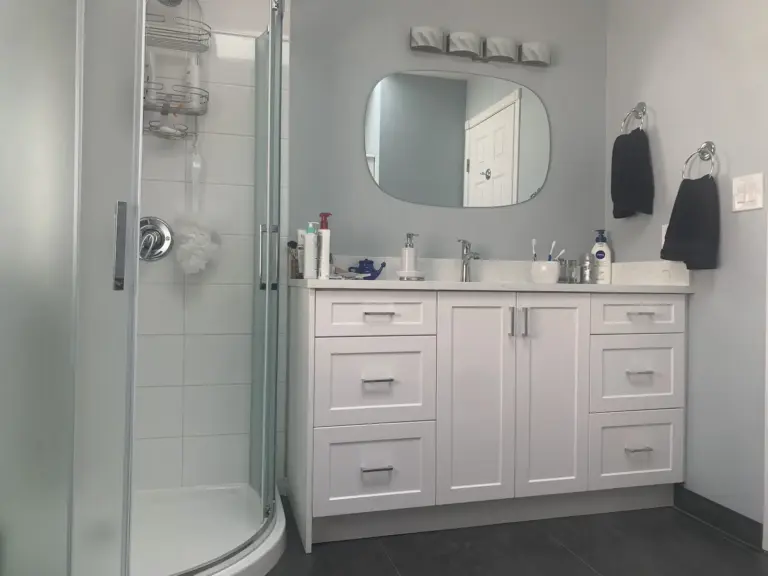White shaker vanity and curved glass shower, bathroom renovation in Surrey