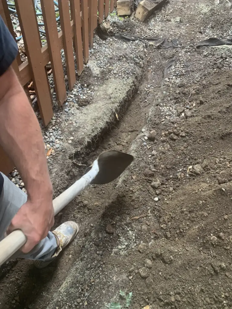 Our crew excavating the side yard for the new walkway