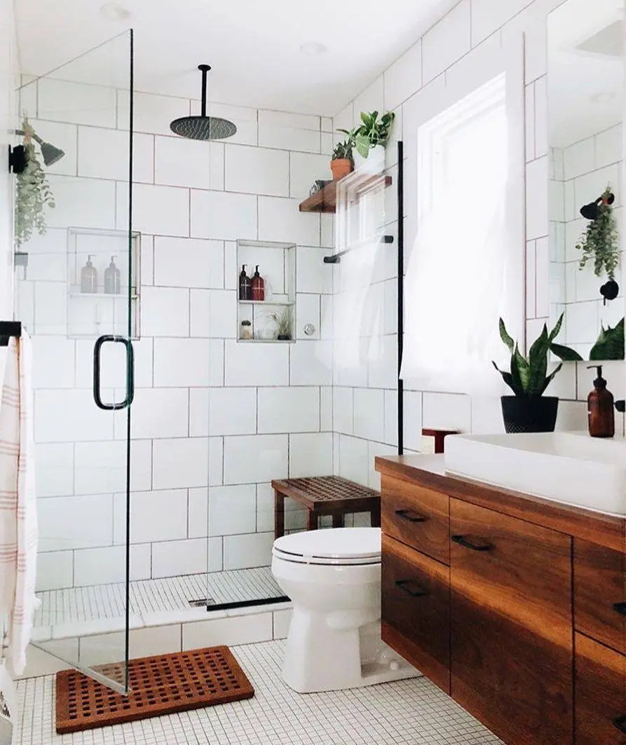 Walk-in shower with frameless glass, rain head and wood vanity
