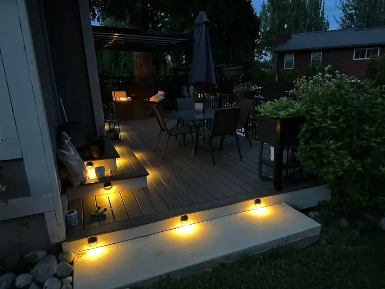Deck steps with built-in lighting at dusk