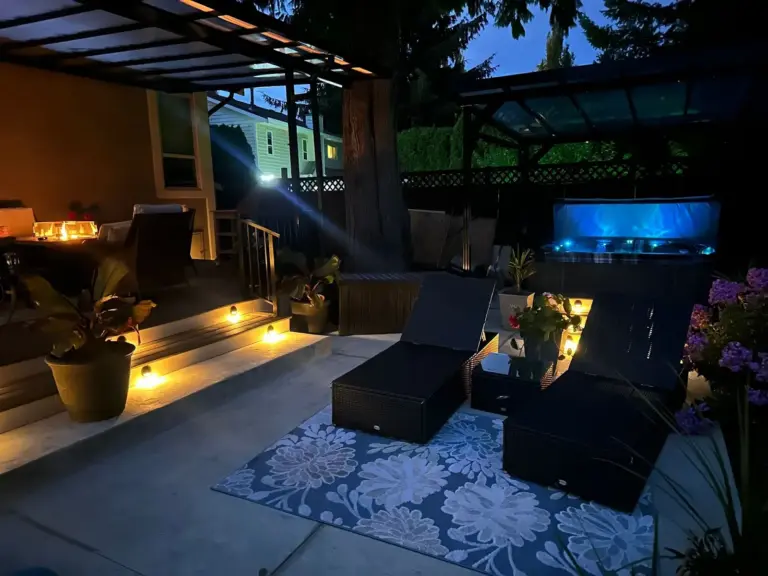 Hot tub area beside the deck at night