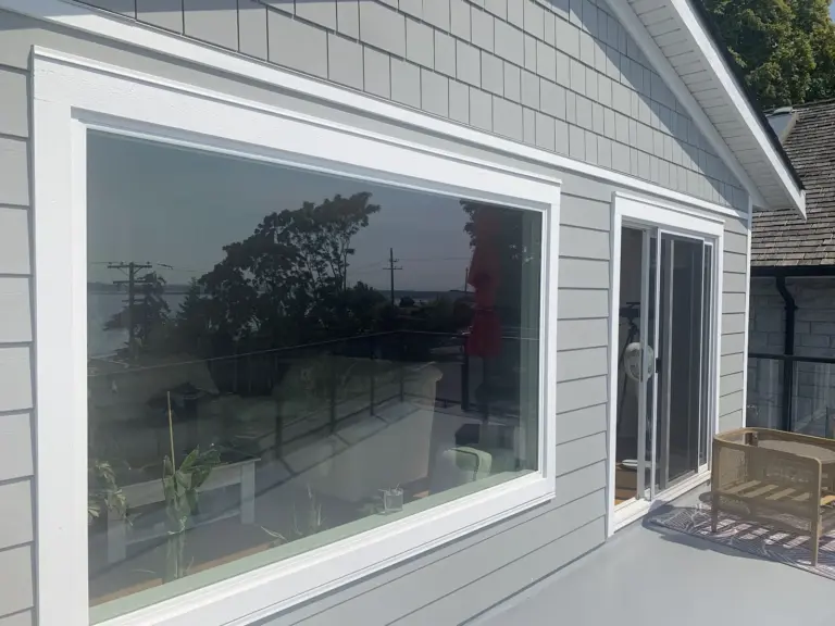 Close-up of the new picture window and siding, exterior renovation in White Rock